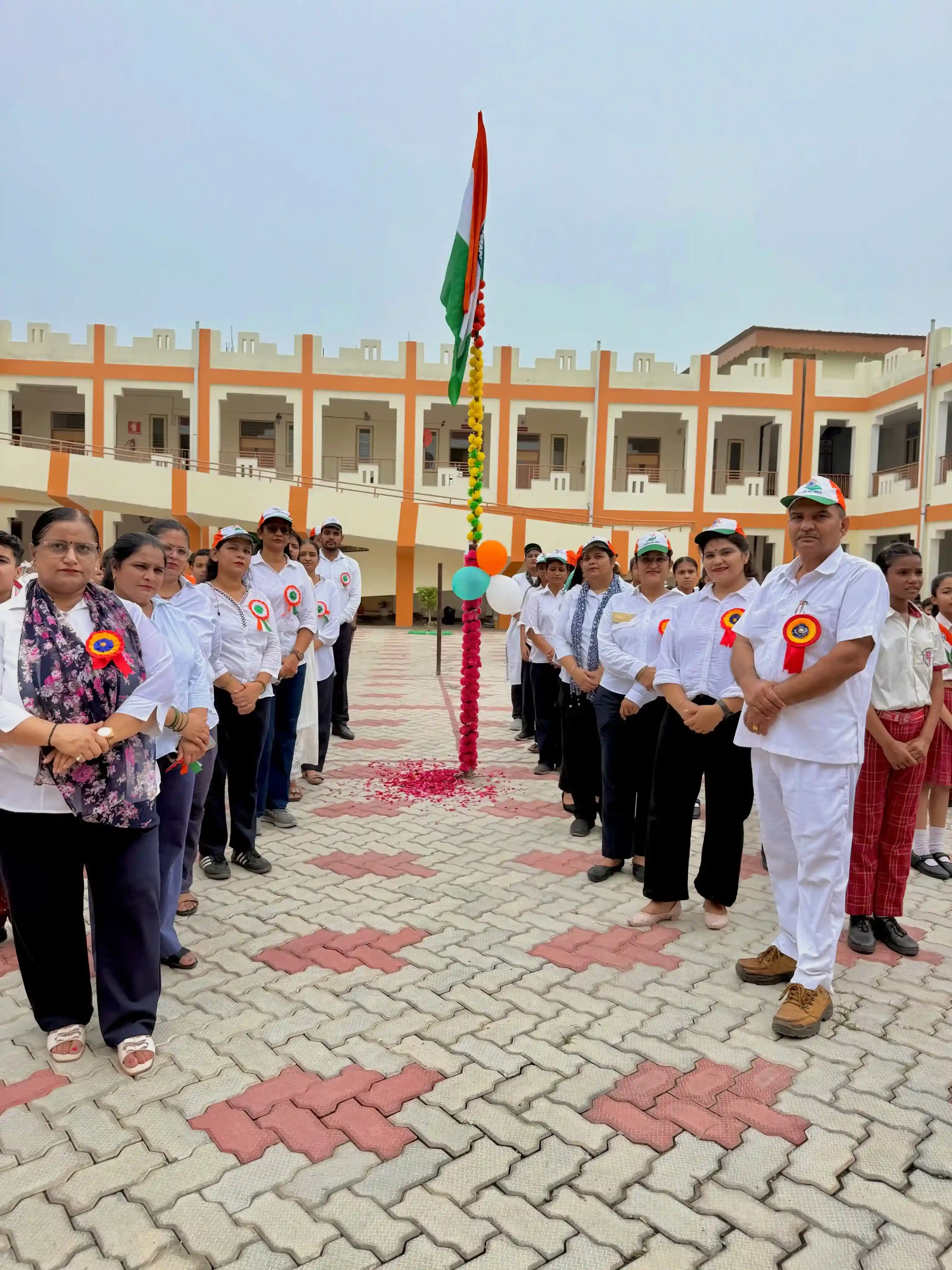 Students in traditional dress at the entrance of Global Paradise Convent School